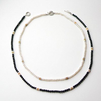 Pearl and black onyx necklace strands